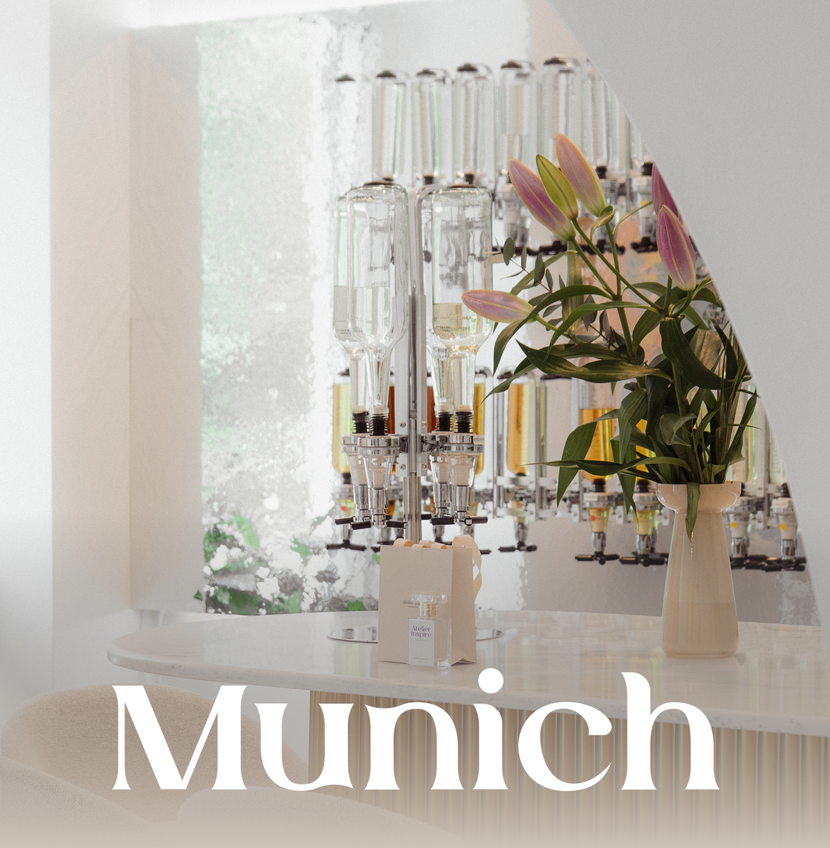 Modern perfume bar setup with stools and a decorative archway.